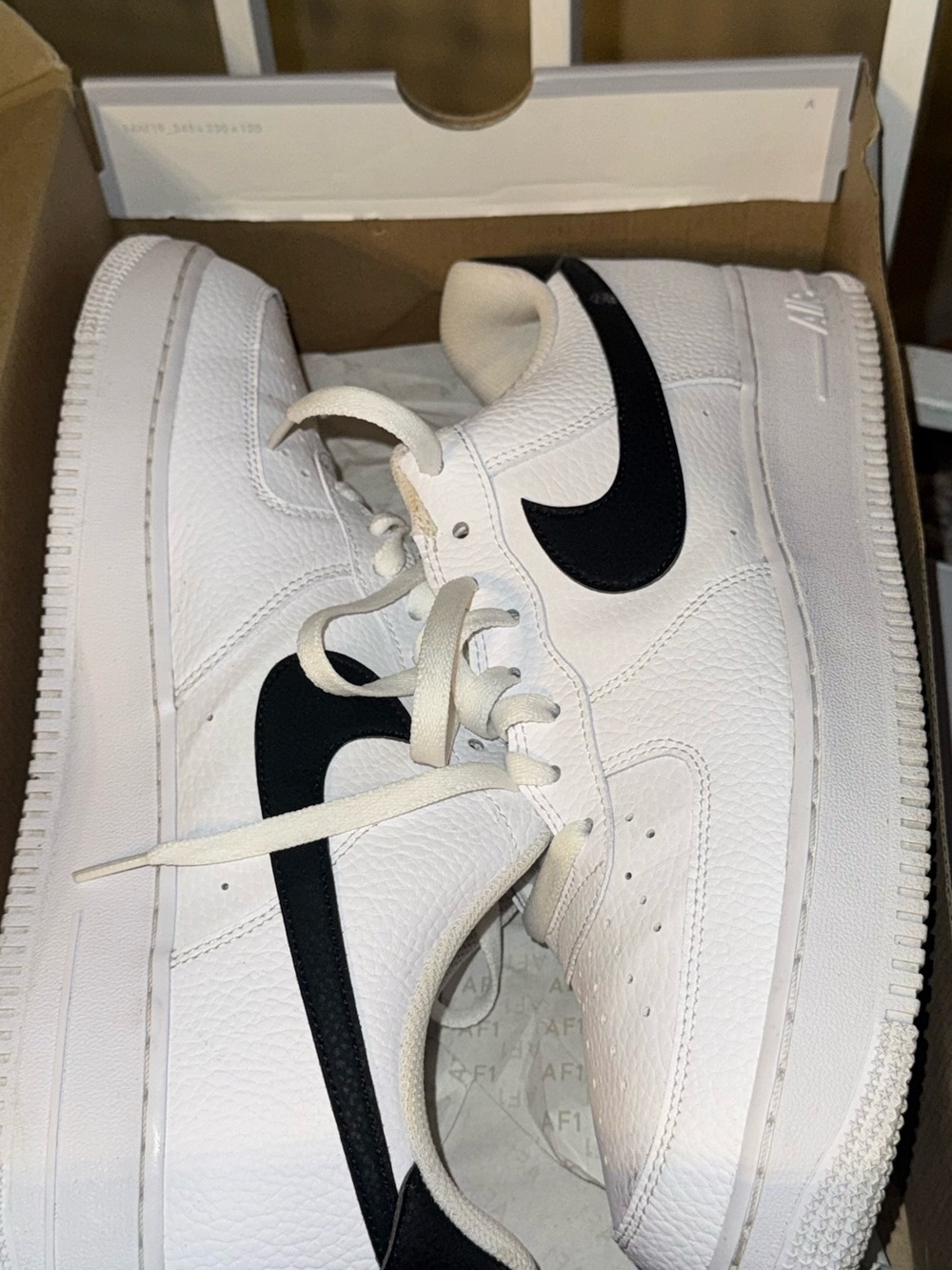 Nike White Leather Low-Top Sneakers with Black Swoosh
